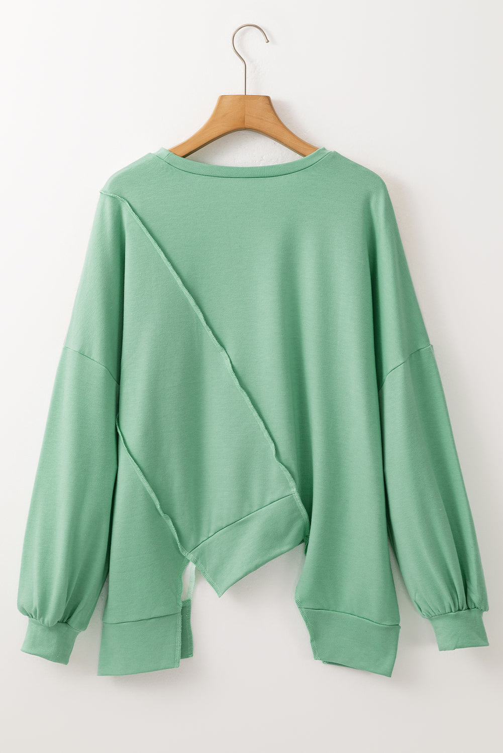 Light French Beige colorblock long sleeve top with irregular hem and patchwork stitching