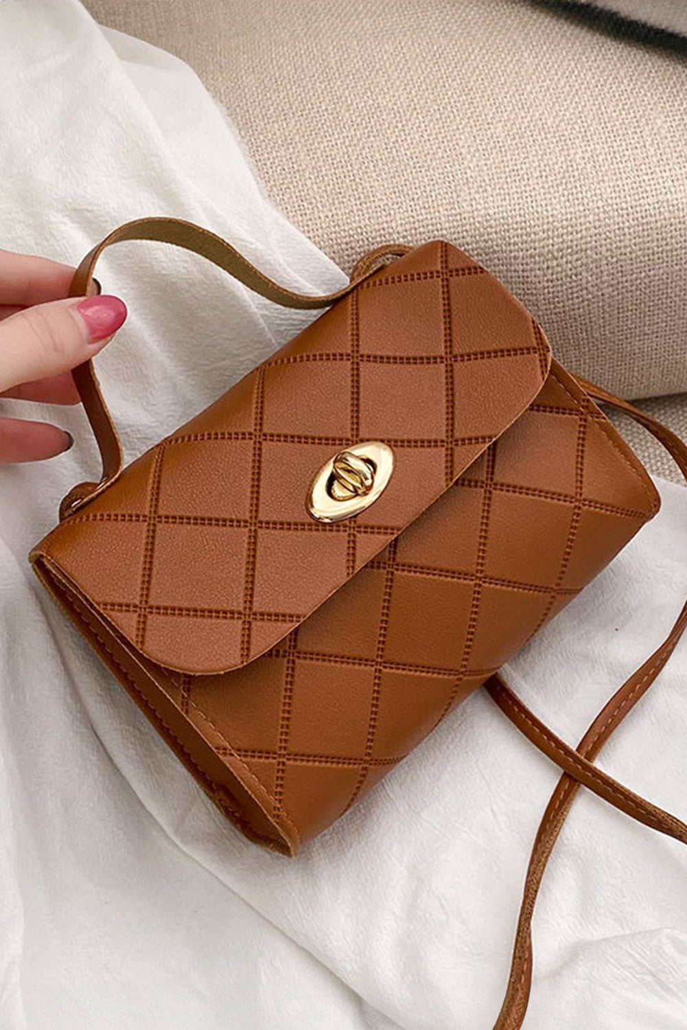 Small Breen PU leather messenger bag with elegant diamond pattern and secure lock mechanism