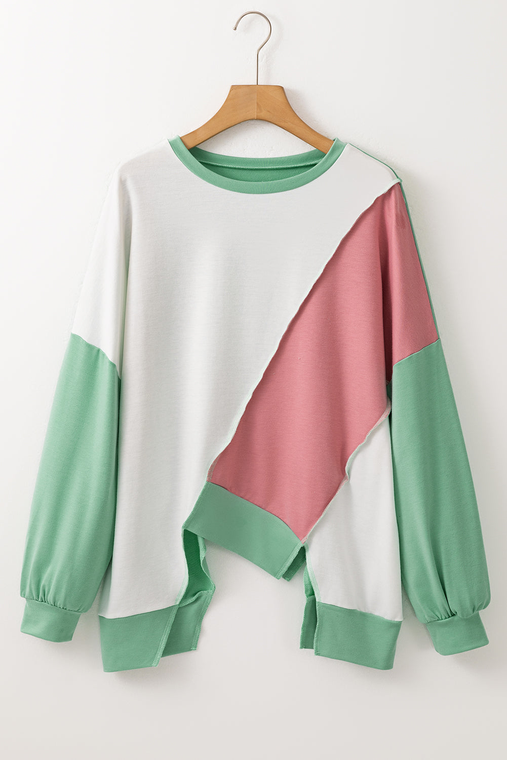 Light French Beige colorblock stitched long sleeve top with irregular hem and crew neckline