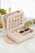 White multi layers lint lined jewelry organizer with buttoned closure and multiple compartments