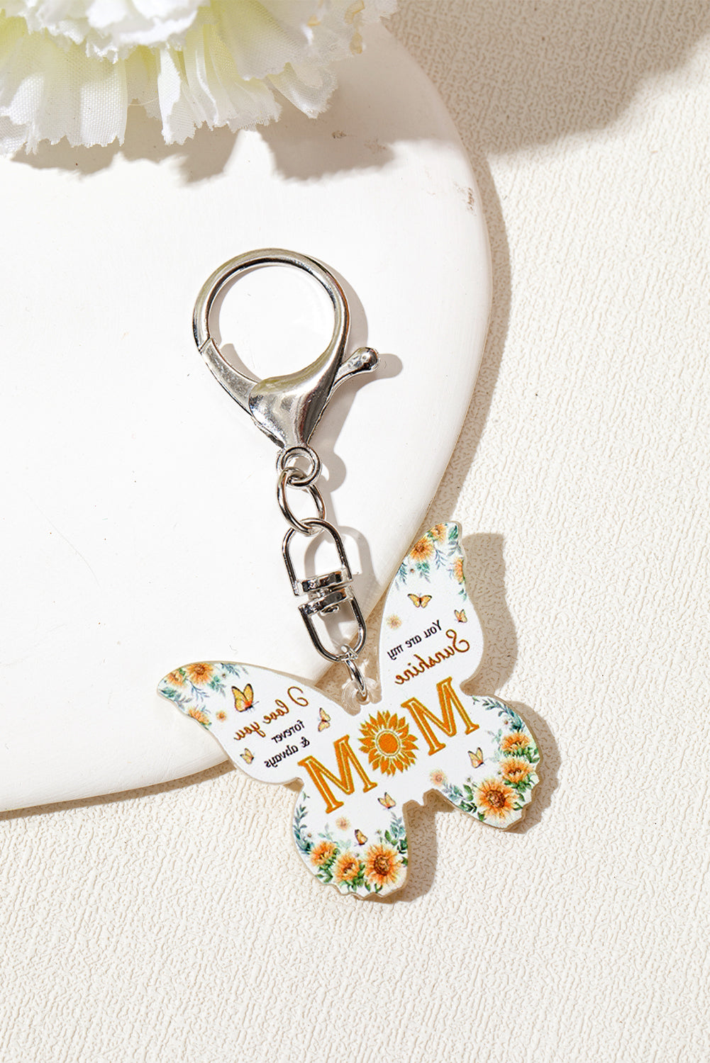 Yellow MOM butterfly shape acrylic keychain with bold font and durable design