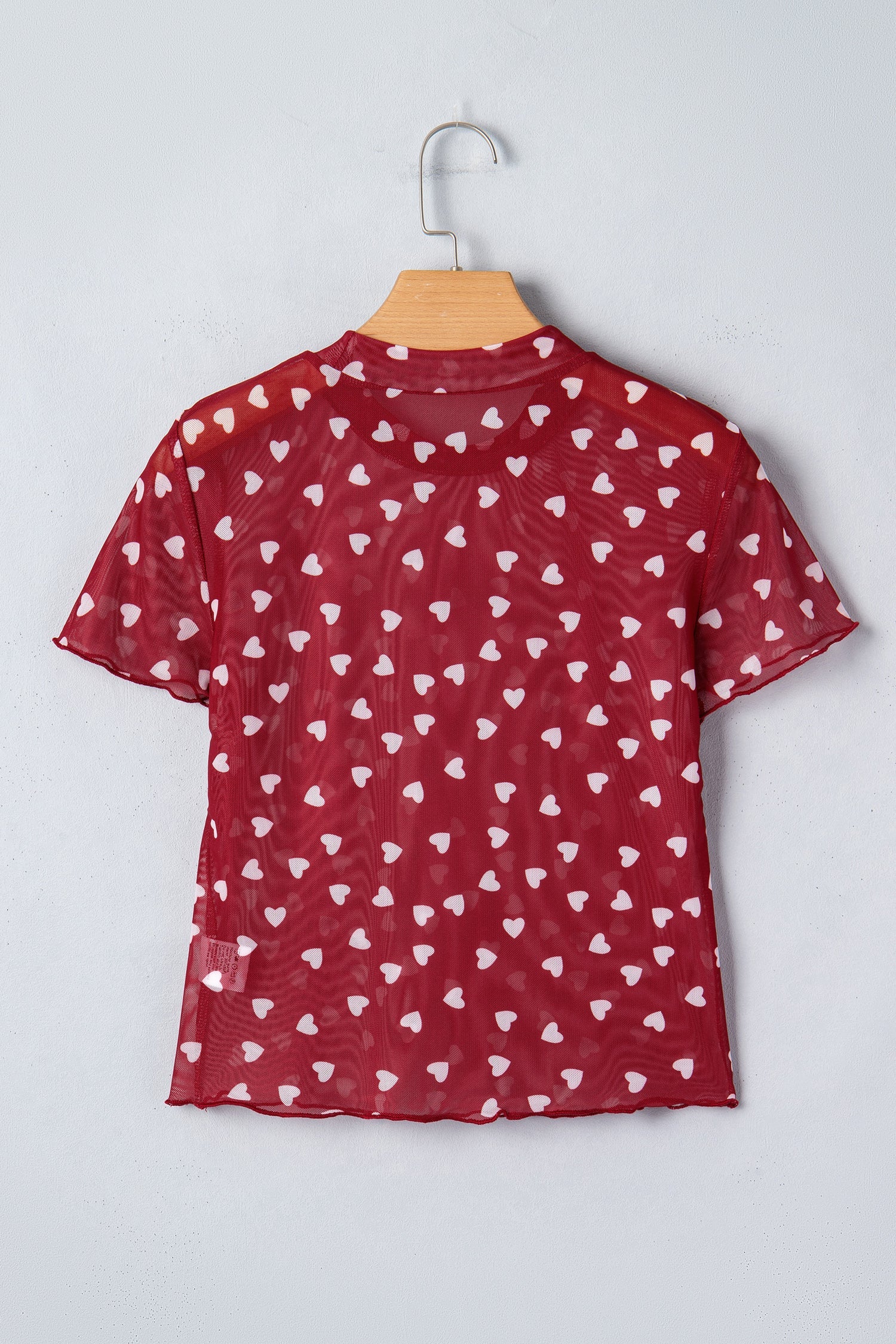 Pink mesh short sleeve crop top with allover heart print and lettuce trim neckline