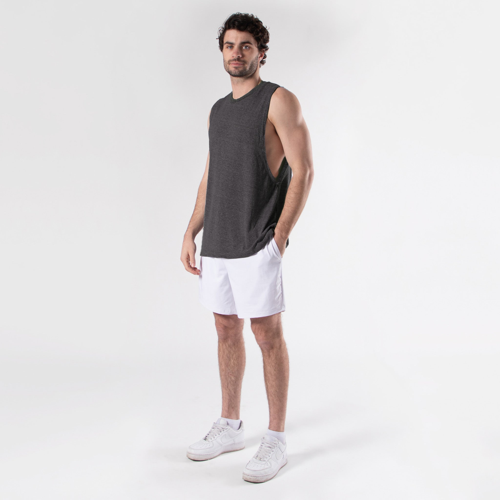 Lightweight men's muscle tee with deep armholes and relaxed fit for workout and loungewear