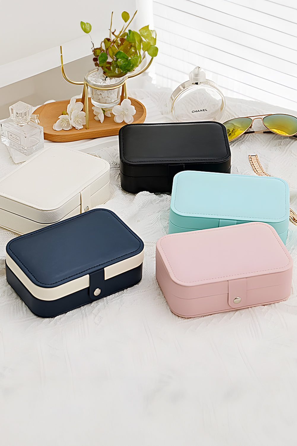 White multi layers portable jewelry organizer with lint-lined compartments and buttoned closure