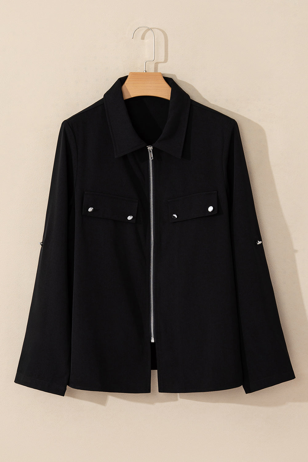 Black collar jacket with tab sleeves and zip-up flap detail