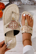 Beige leather thong slippers with stylish metal decor and adjustable strap