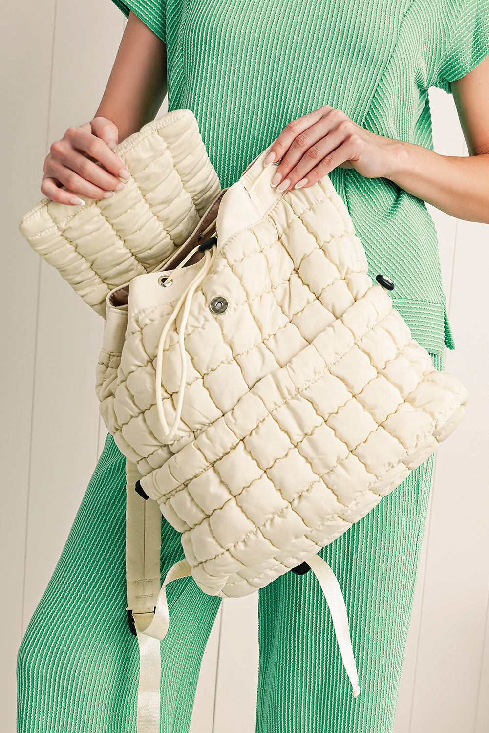 Black solid flapped quilted puffer backpack with spacious interior and modern stylish design