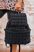 Black solid flapped quilted puffer backpack with spacious interior and modern design