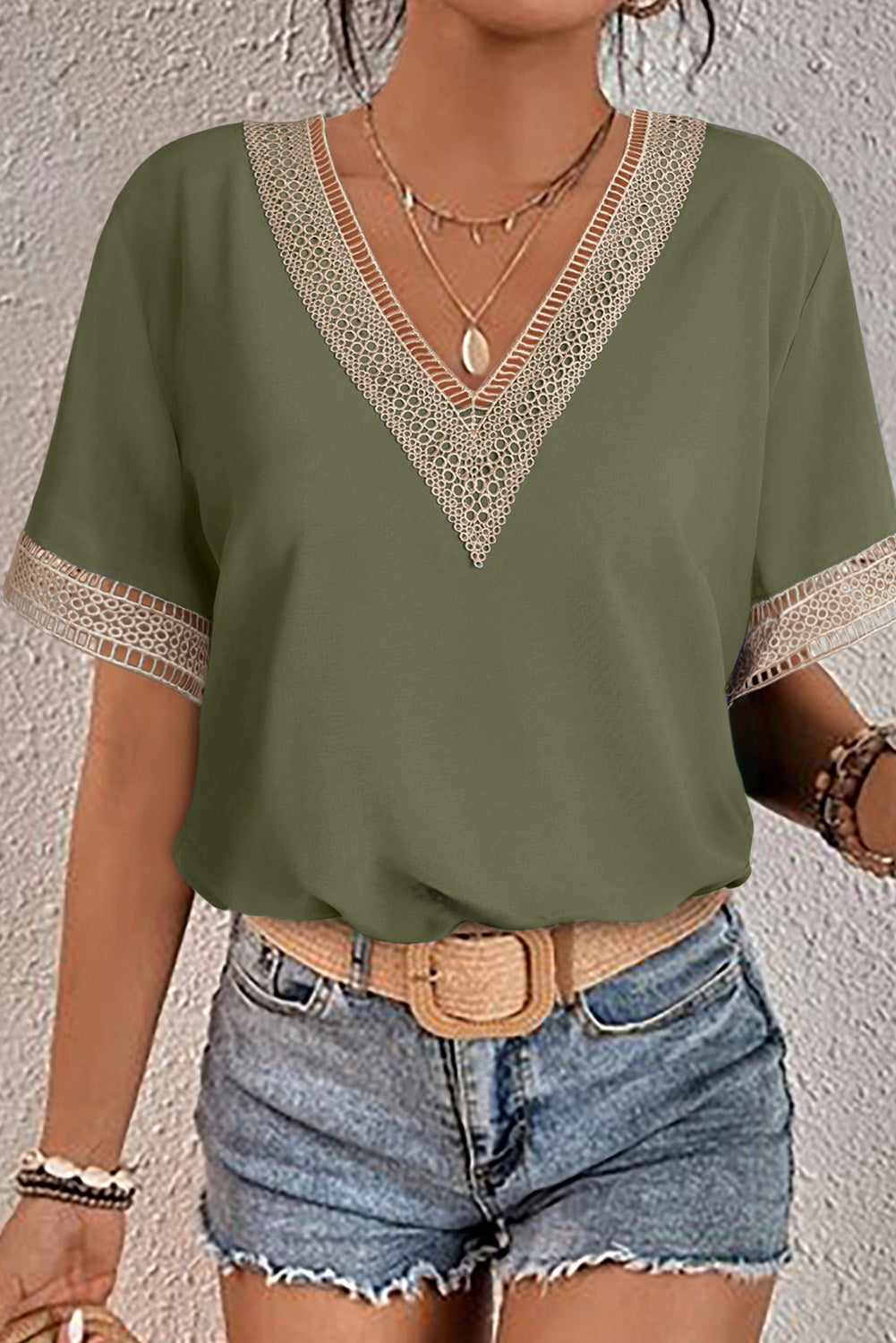 Green blouse with lace trim and V-neck short sleeves