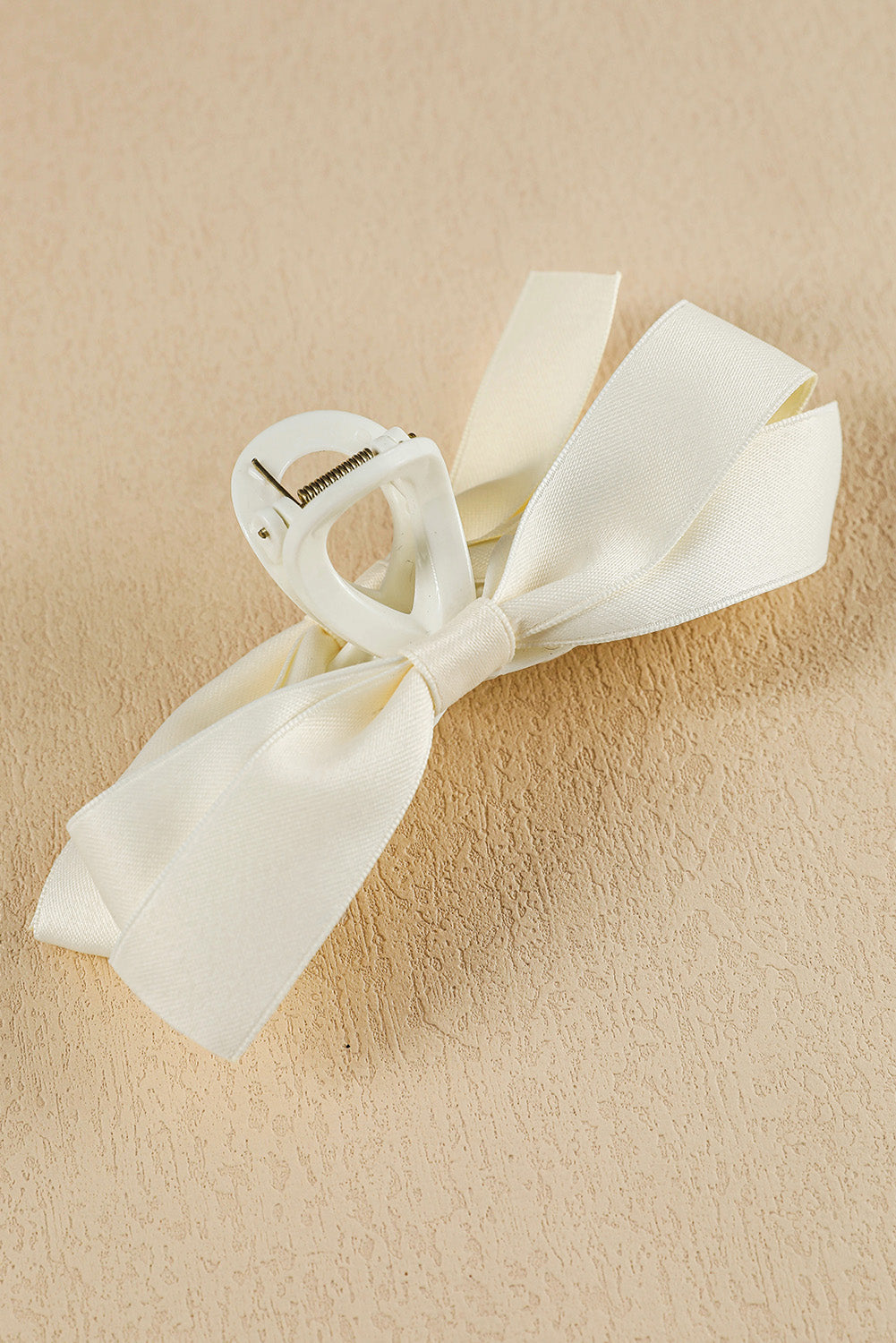 Large black hair claw clip with stylish bow decor for securing all hair types