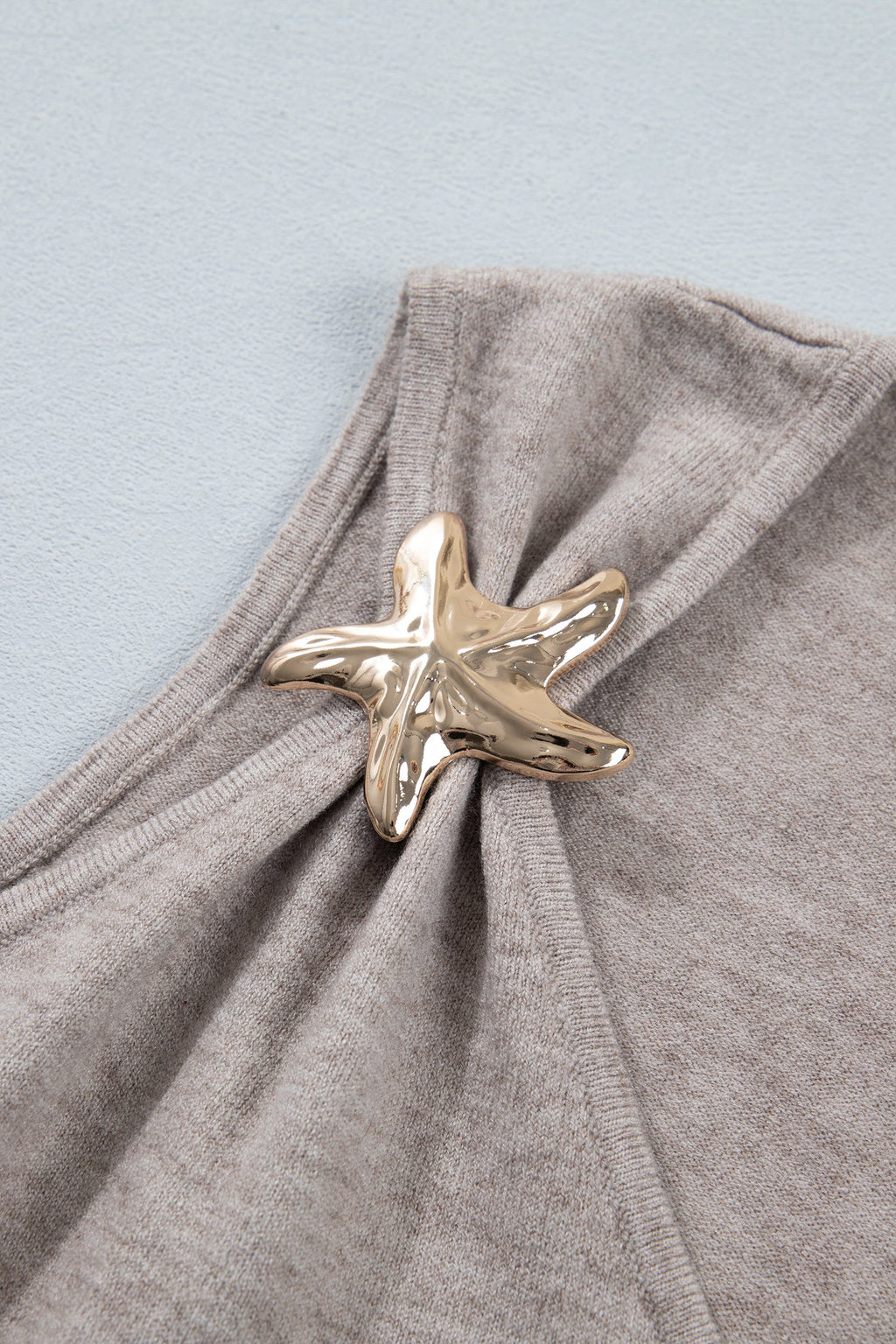 Gray Morn sleeveless V neck knit tank top with metallic star details and relaxed fit