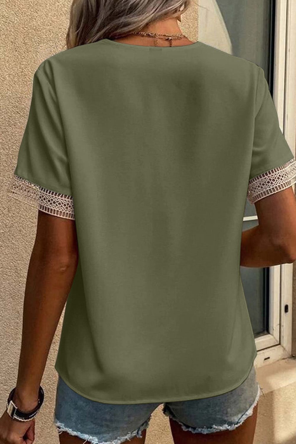 Green V-neck short sleeve blouse with delicate green lace trim