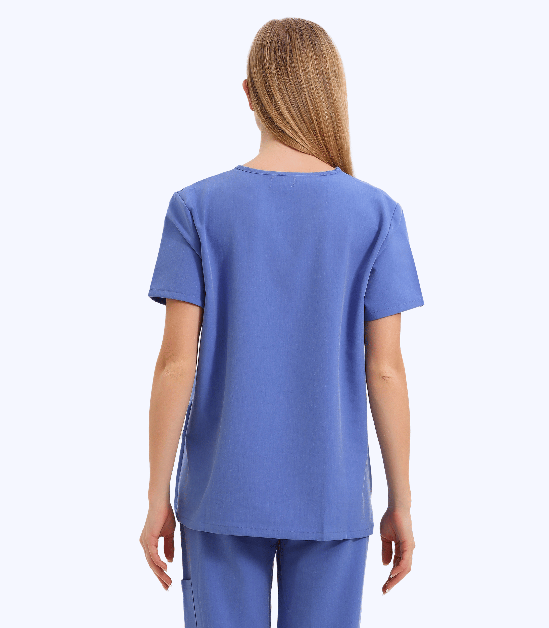 Pregnant medical professional wearing pink maternity scrub top from Maternity Scrubs Collection