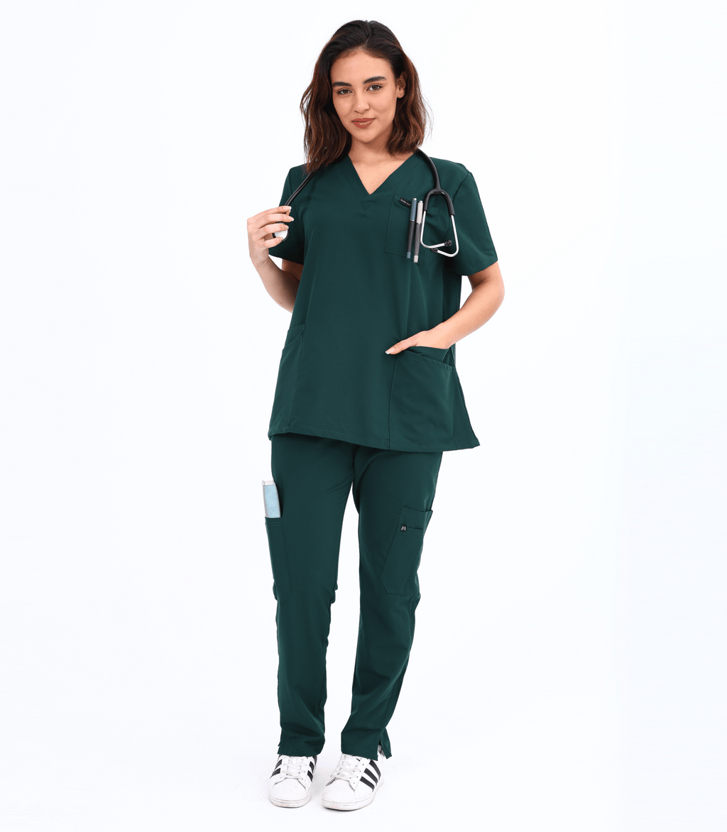 Woman wearing Mae maternity scrub top from Maternity Scrubs Collection designed for comfort and style during pregnancy