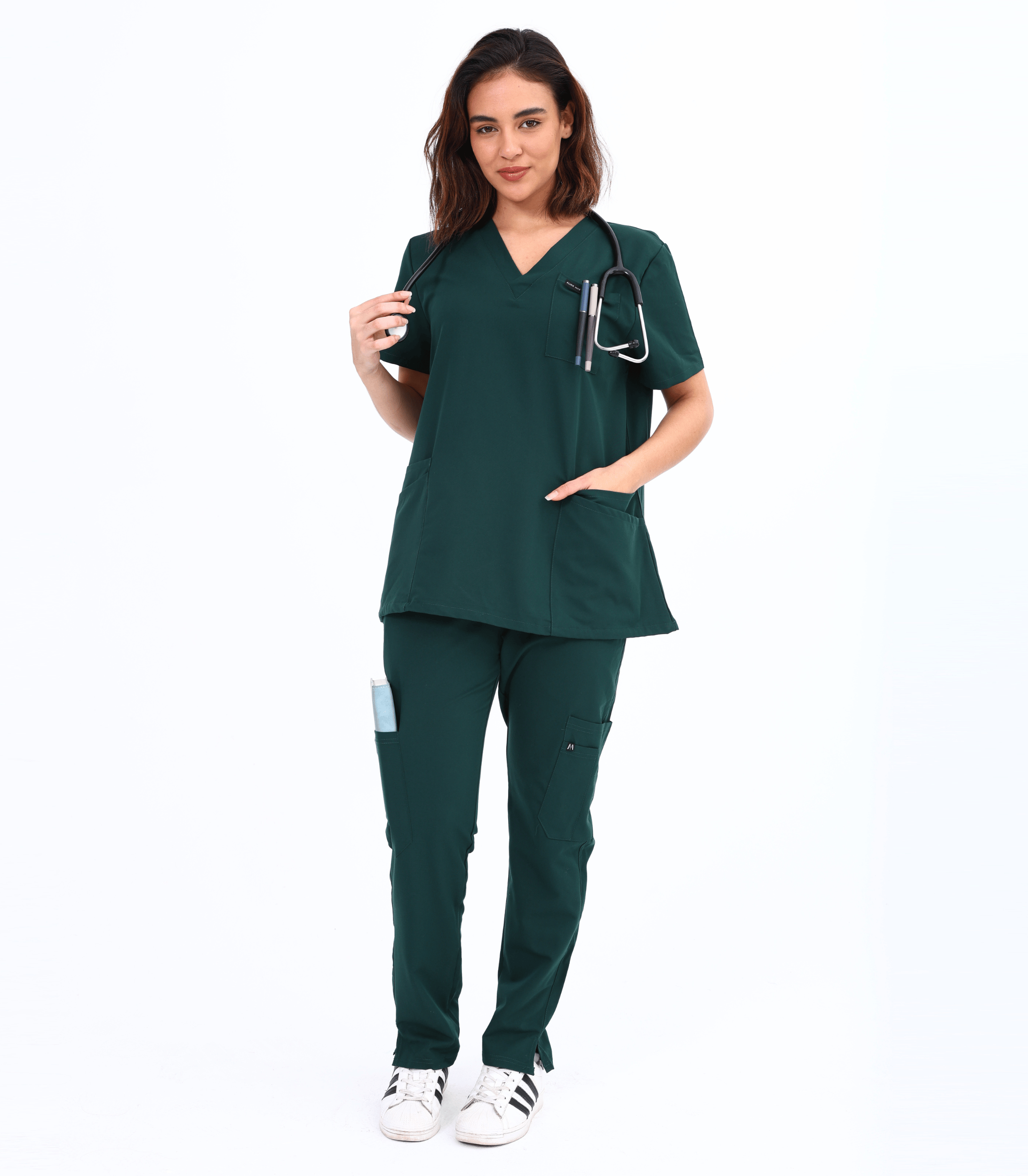 Woman wearing Mae maternity scrub top from Maternity Scrubs Collection designed for comfort and style during pregnancy