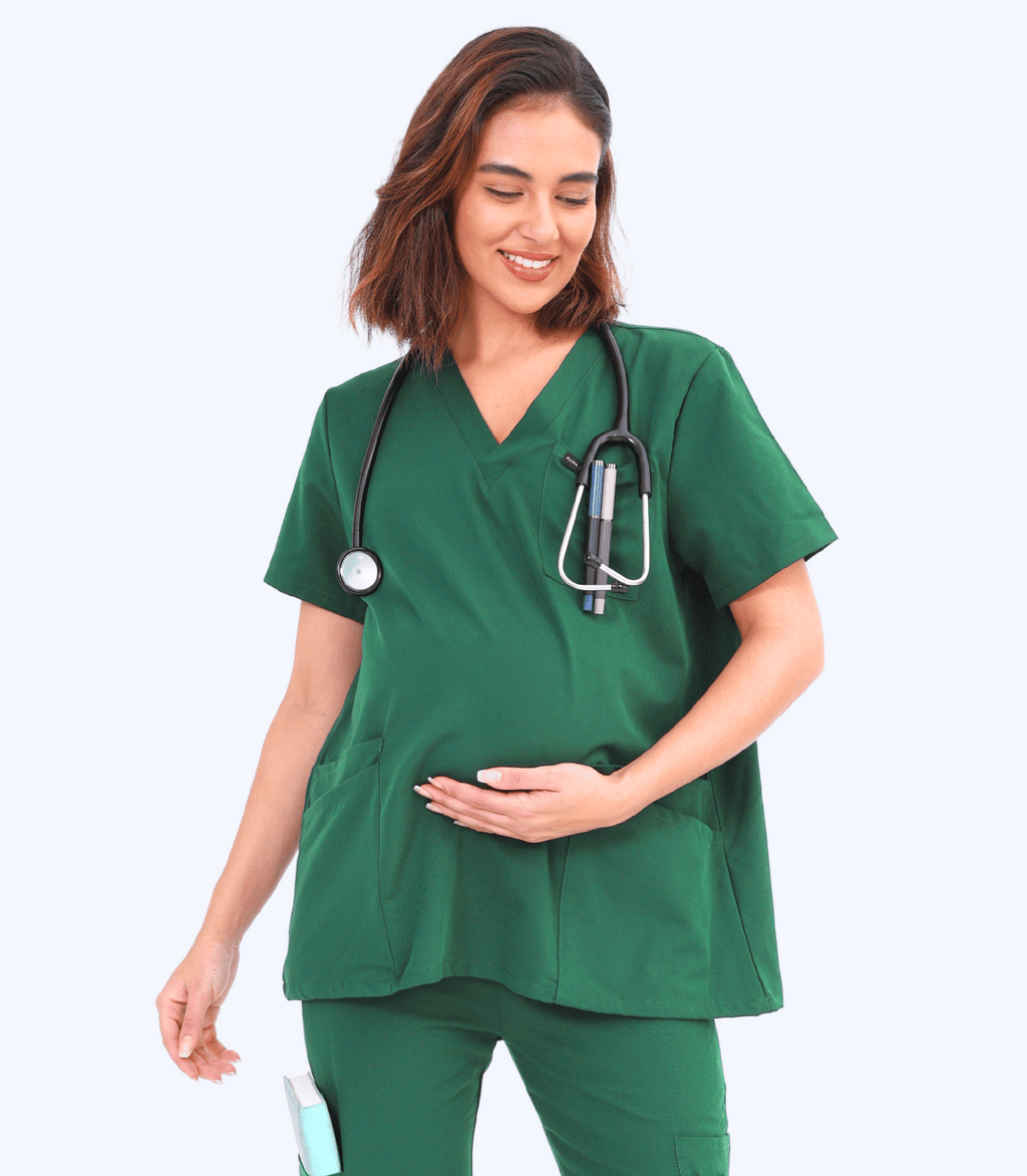 Pregnant woman wearing stylish and comfortable maternity scrubs from the Maternity Scrubs Collection designed for medical professionals.