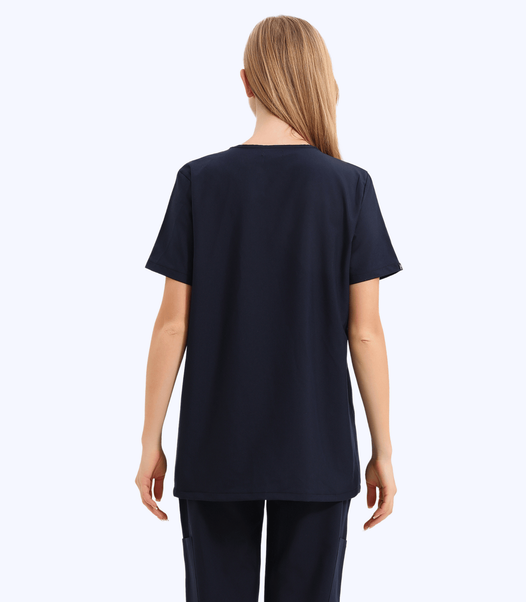 Pregnant medical professional wearing stylish and comfortable maternity scrubs from the Maternity Scrubs Collection