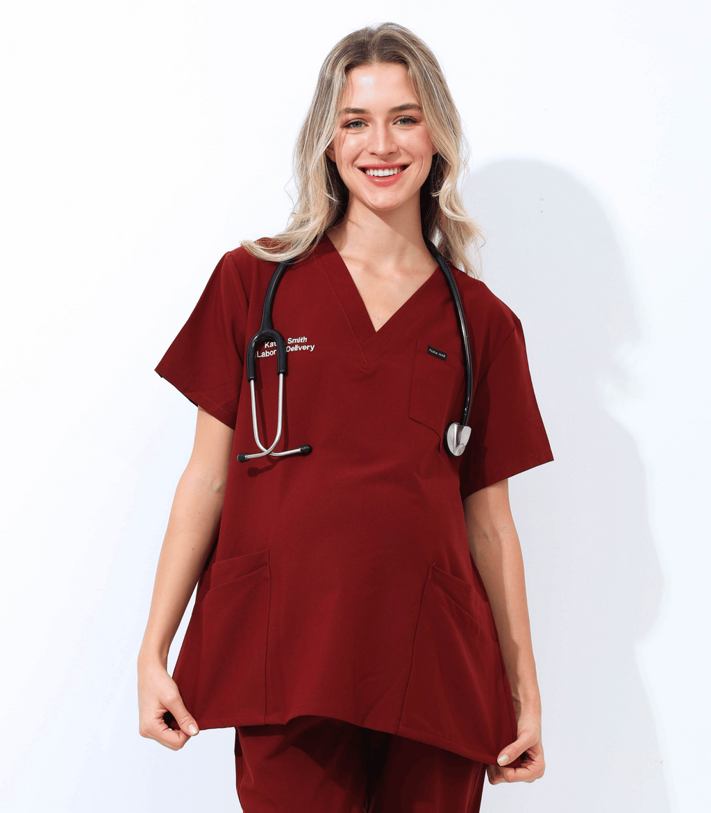 Pregnant medical professional wearing comfortable stylish maternity scrubs from Maternity Scrubs Collection