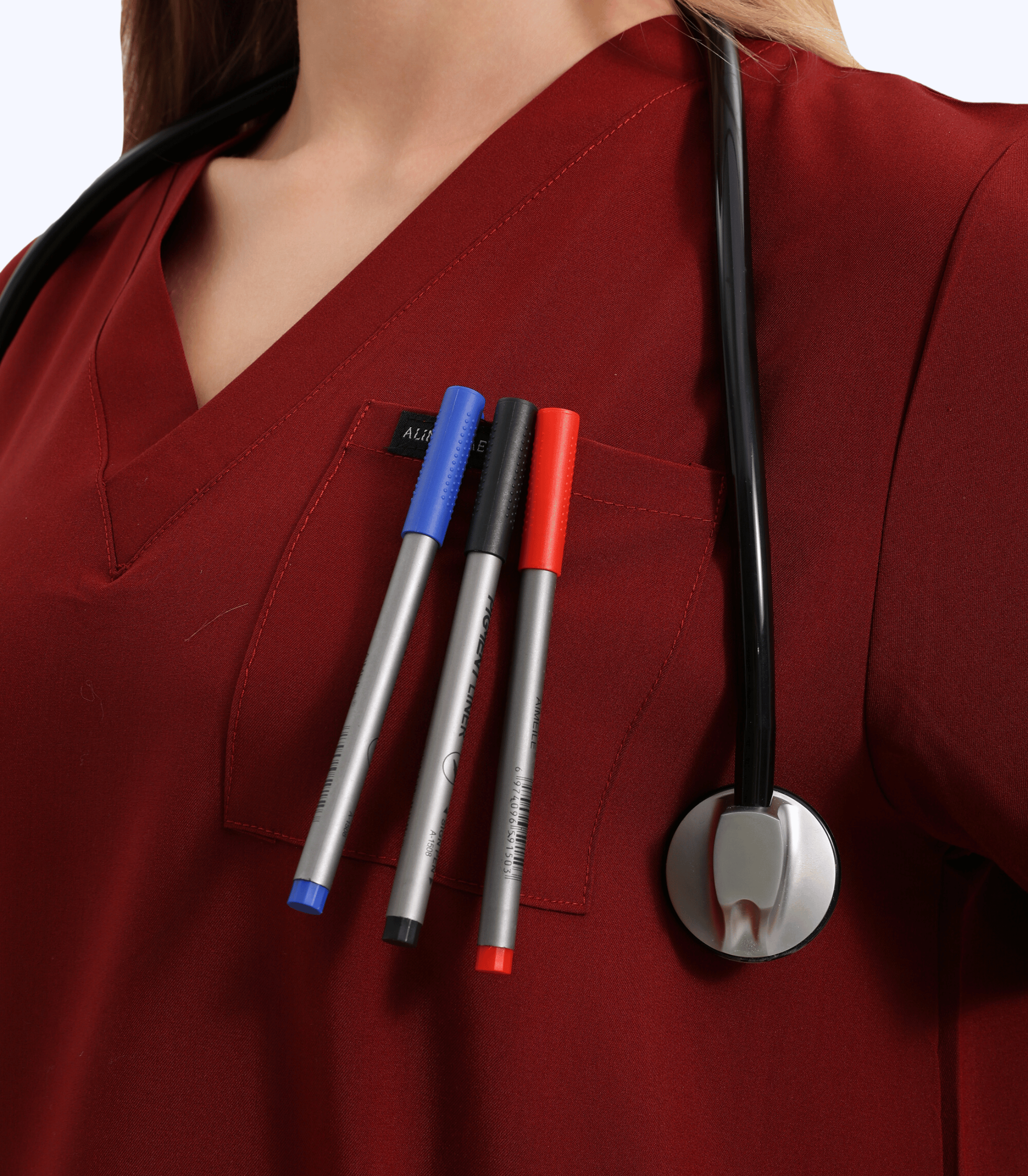 Pregnant medical professional wearing stylish and comfortable maternity scrubs top from Maternity Scrubs Collection