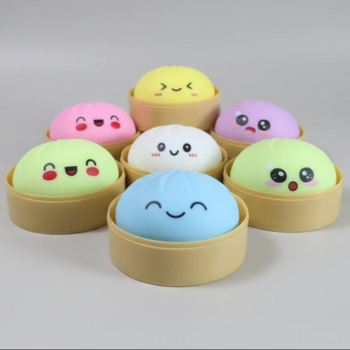 Pastel soft squish mystery dumplings in sealed blind box packaging