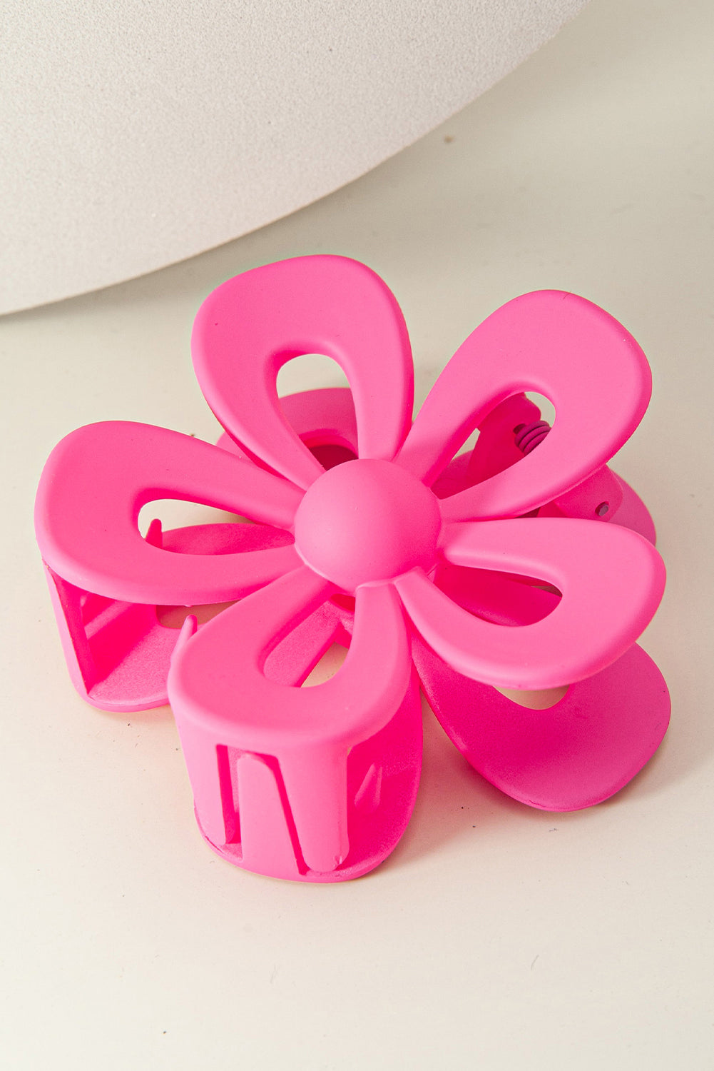 Black sweet hollowed flower shaped claw clip with frosting finish for hair styling