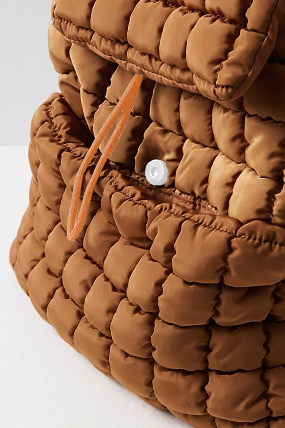Black solid flapped quilted puffer backpack with spacious interior and modern design