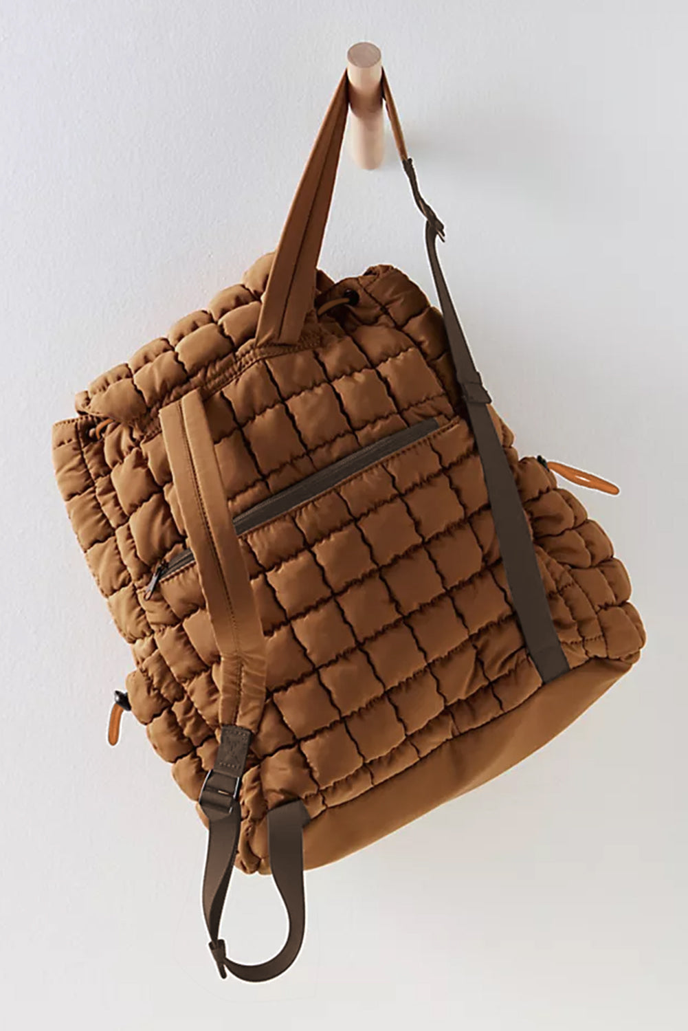 Black solid flapped quilted puffer backpack with spacious interior and modern design