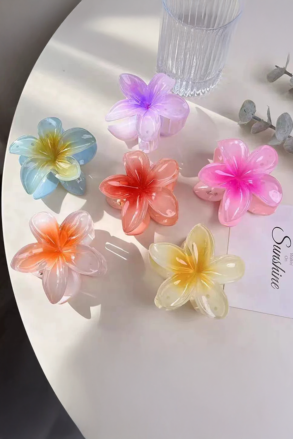 Yellow frangipani shape acrylic hair clip with tropical design and 8cm size