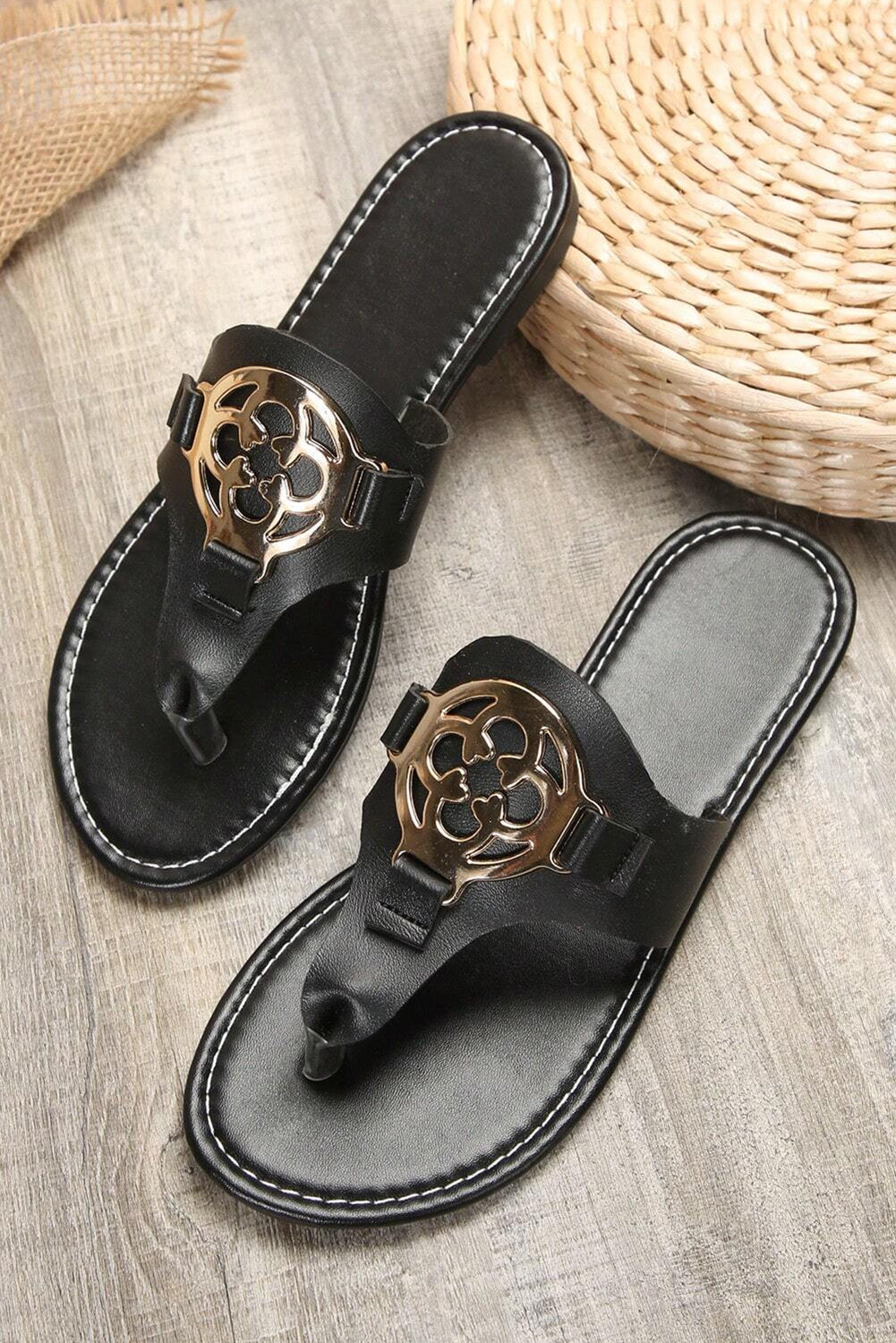 Beige leather thong slippers with stylish metal decor and adjustable straps