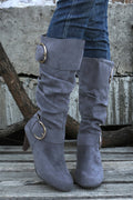 Navy blue mid-calf heeled boots with dual buckle straps and side zip closure