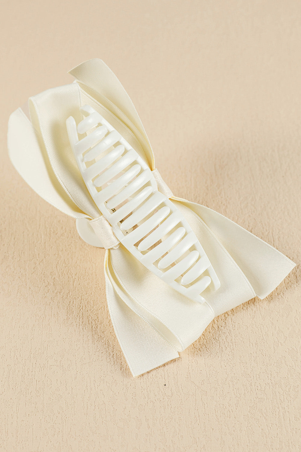 Black bow decor large hair claw clip securing hair with elegant bow design
