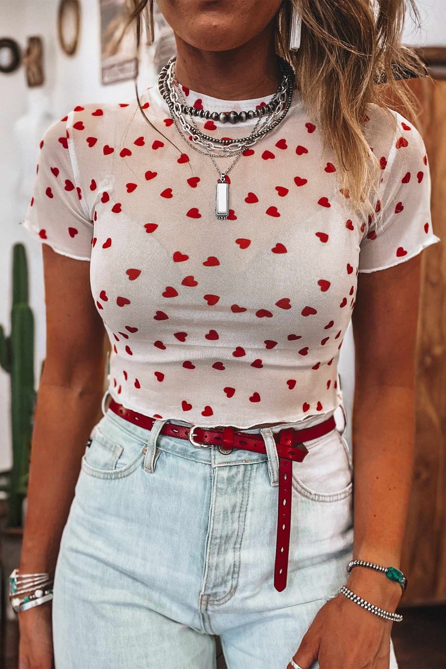 Pink mesh crop top with allover heart print and lettuce trim