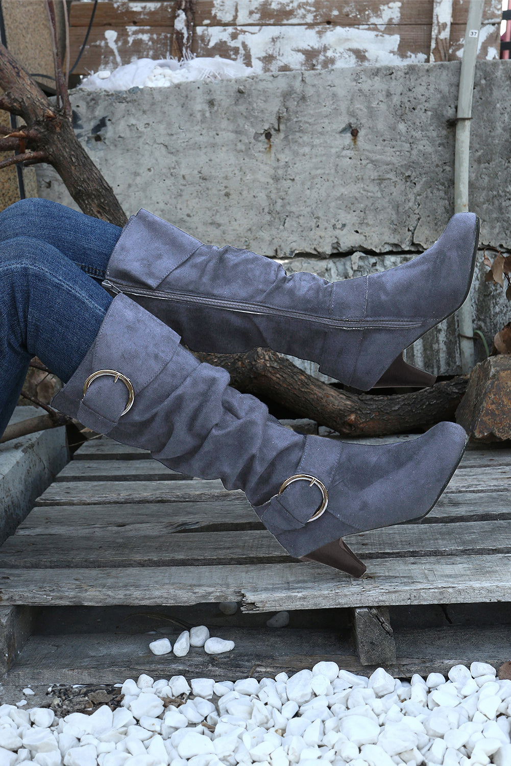 Navy blue mid-calf heeled boots with dual buckle straps and side zip closure