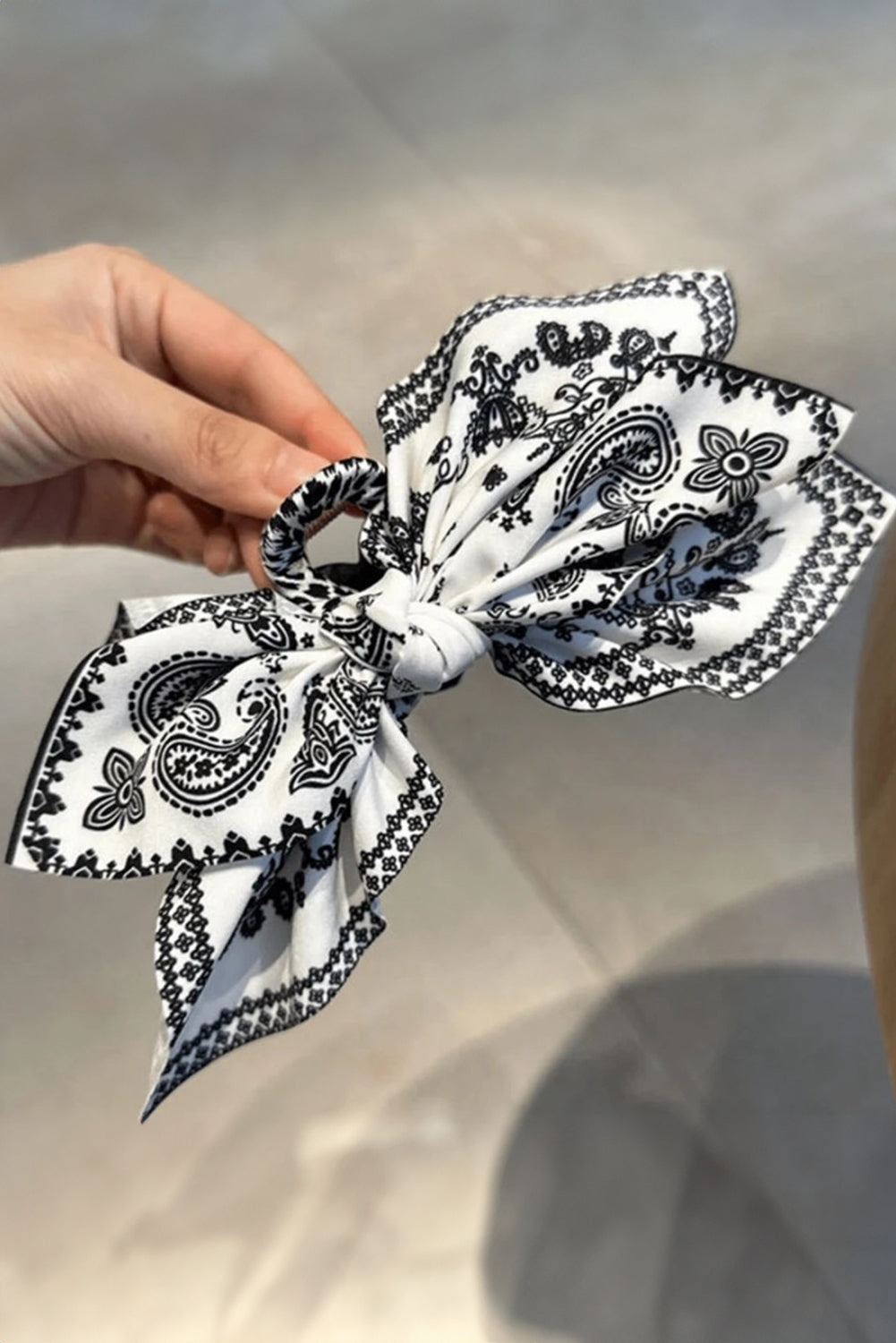 Black paisley floral print bow knot hair clip with trendy design and lightweight material