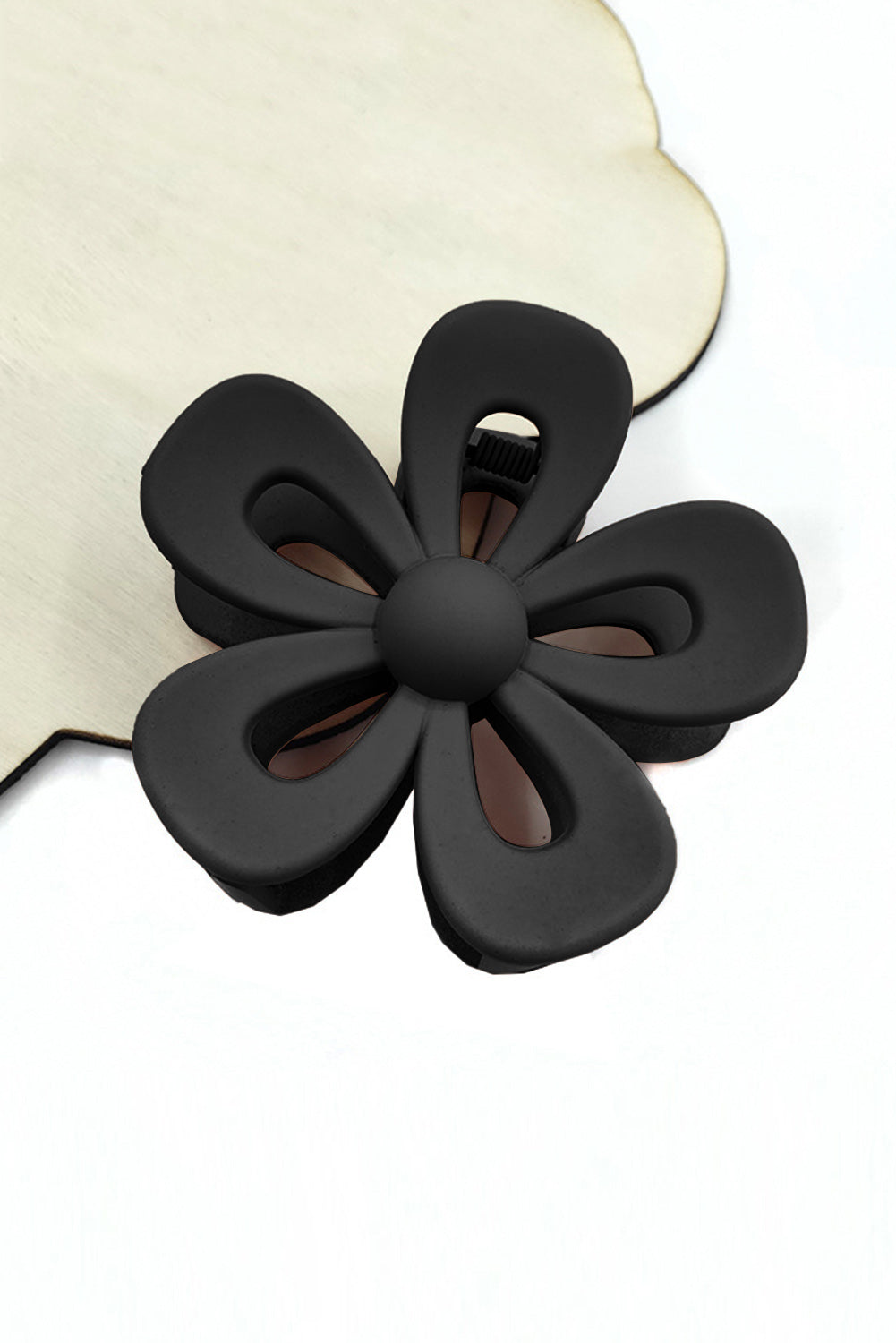 Black sweet hollowed flower shaped claw clip with frosting finish and durable plastic design