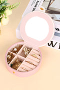 Light pink round jewelry organizer case with snap button and built-in mirror