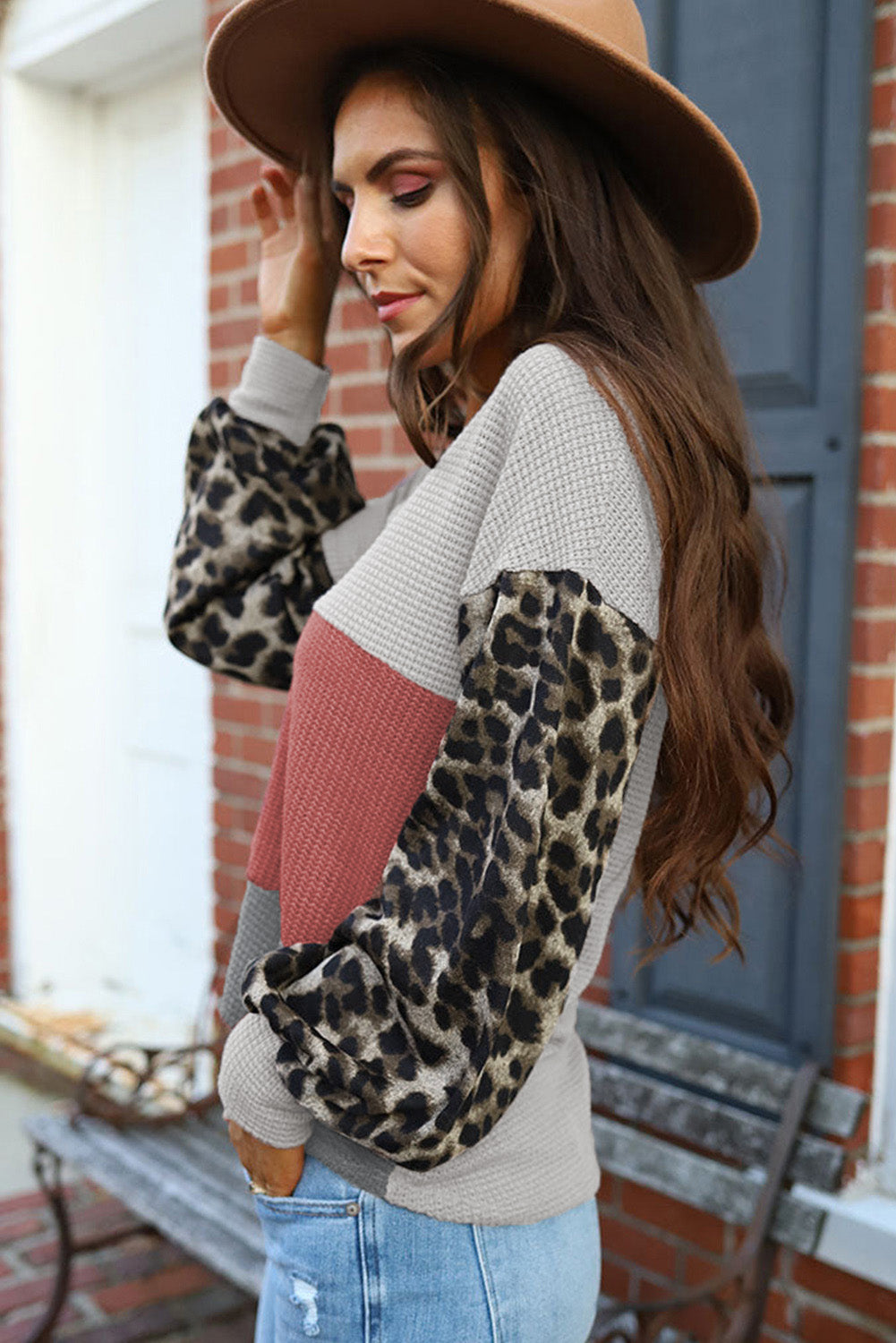 Fiery red top with wild leopard contrast sleeves and V-neck waffle knit design